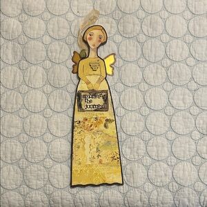 Kelly Rae Robert’s 
Yellow Angel Mixed Media Wall Hanging